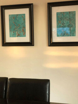 Picture of Modern Abstract paintings on wall above dining room table